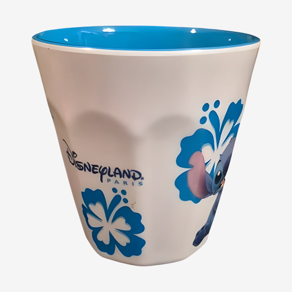 Once Upon Magic white hard plastic children's cup with blue Stitch and floral design, Disneyland Paris logo.