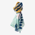 Once Upon Magic Street Stitch scarf with turquoise, navy, mustard yellow, and coral graphic pattern. Lightweight and fluid.