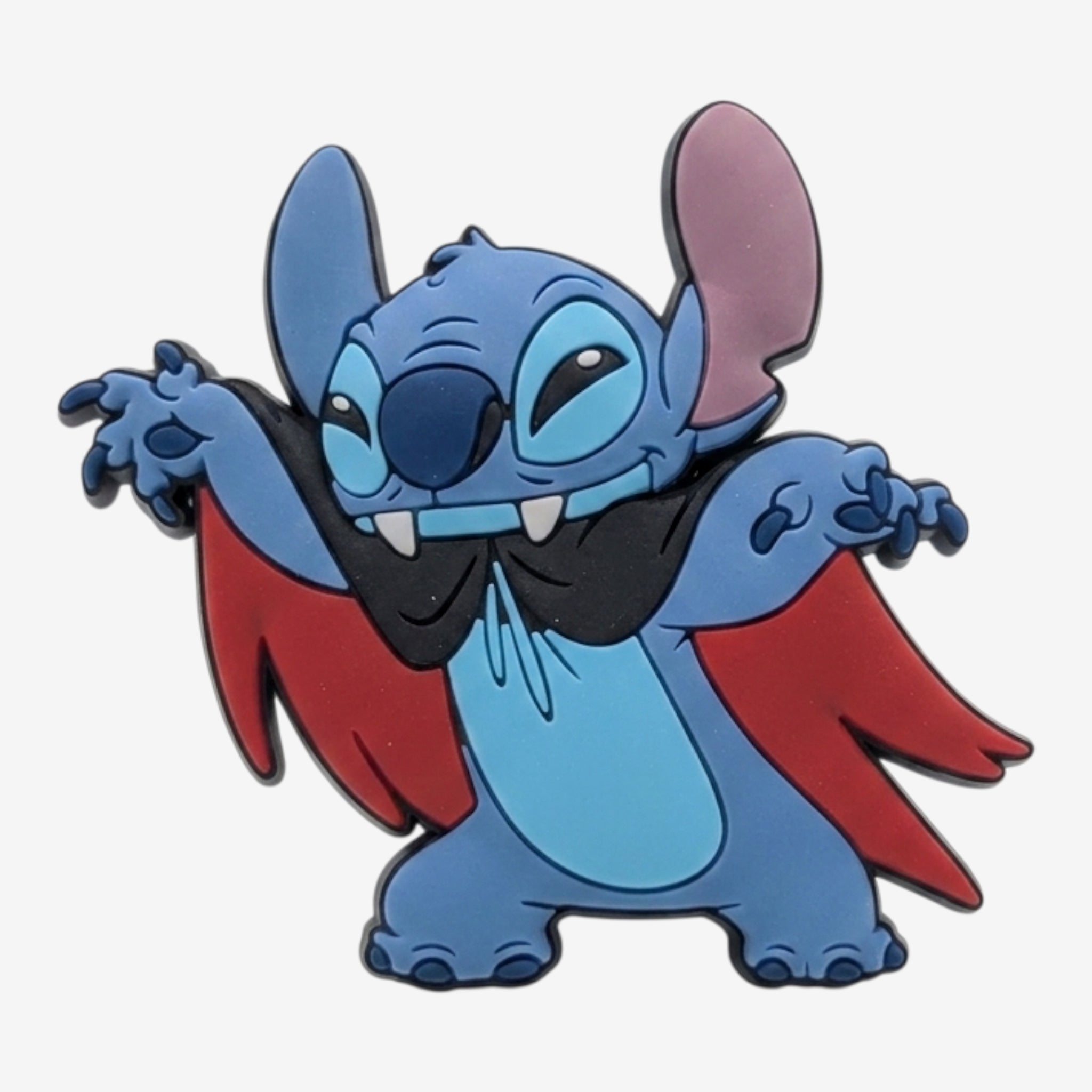 Once Upon Magic Stitch magnet dressed as a vampire with a black and red cape and fangs.