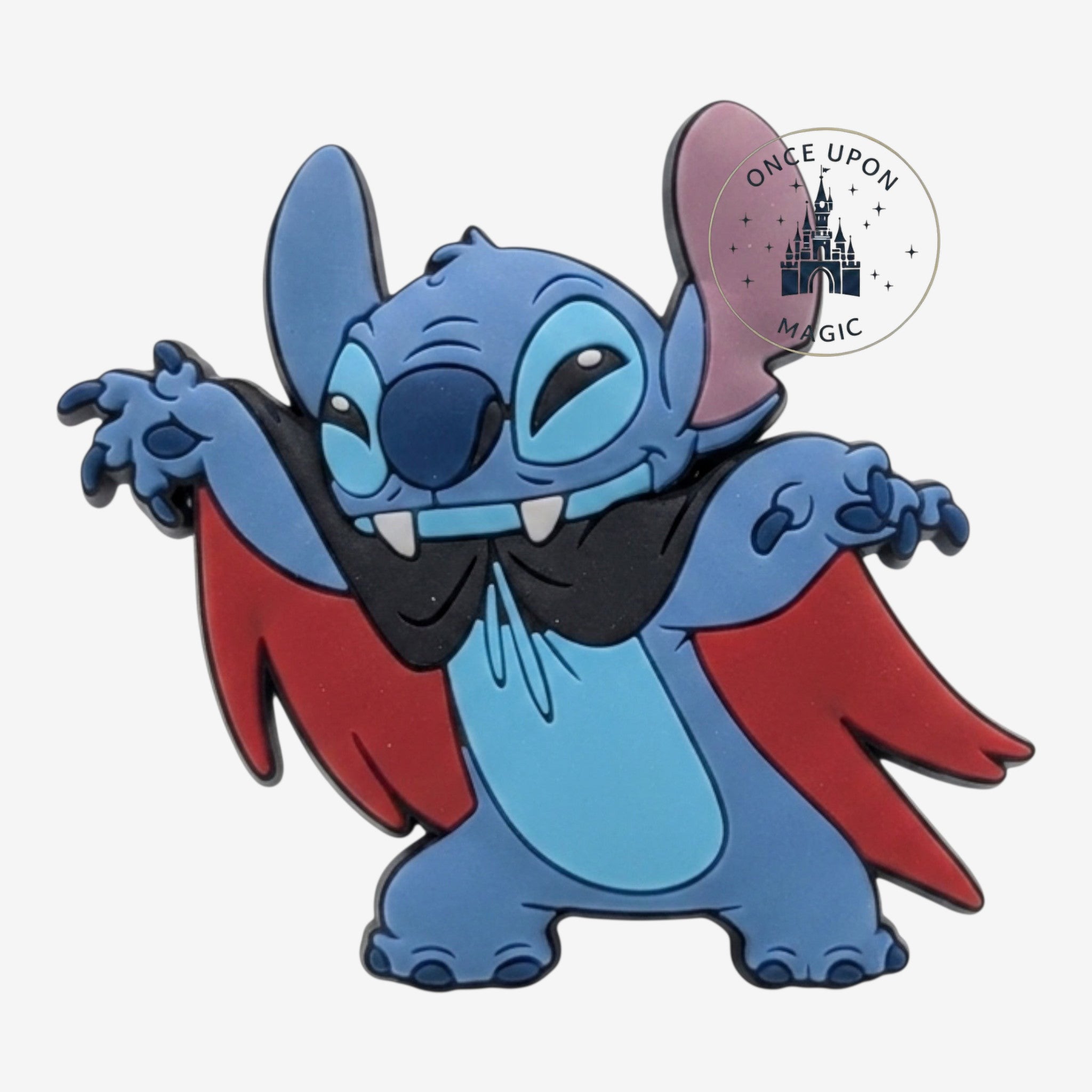Once Upon Magic Stitch magnet dressed as a vampire with a black and red cape and fangs.