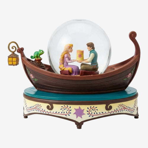 Once Upon Magic Tangled musical snow globe featuring Rapunzel and Flynn Rider in a boat with Pascal and a lantern. Plays "I See the Light".