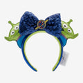 Once Upon Magic Toy Story Alien ears headband with blue sequin bow and planet detail. Green alien ears with large eyes.