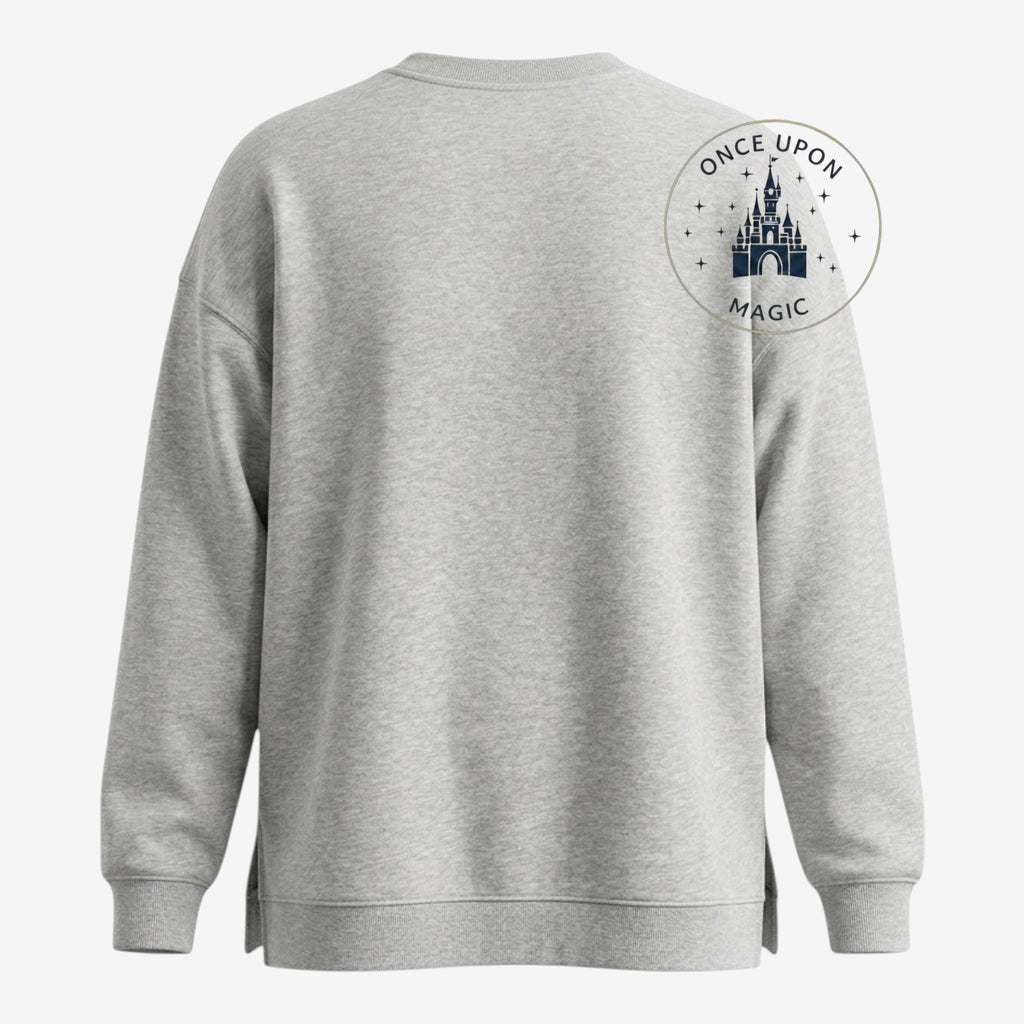 Once Upon Magic light grey crewneck sweatshirt with Winnie the Pooh and friends floral wreath graphic on front. Soft cotton blend.