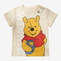 Once Upon Magic cream cotton t-shirt with Winnie the Pooh holding a honey pot and a bee graphic.