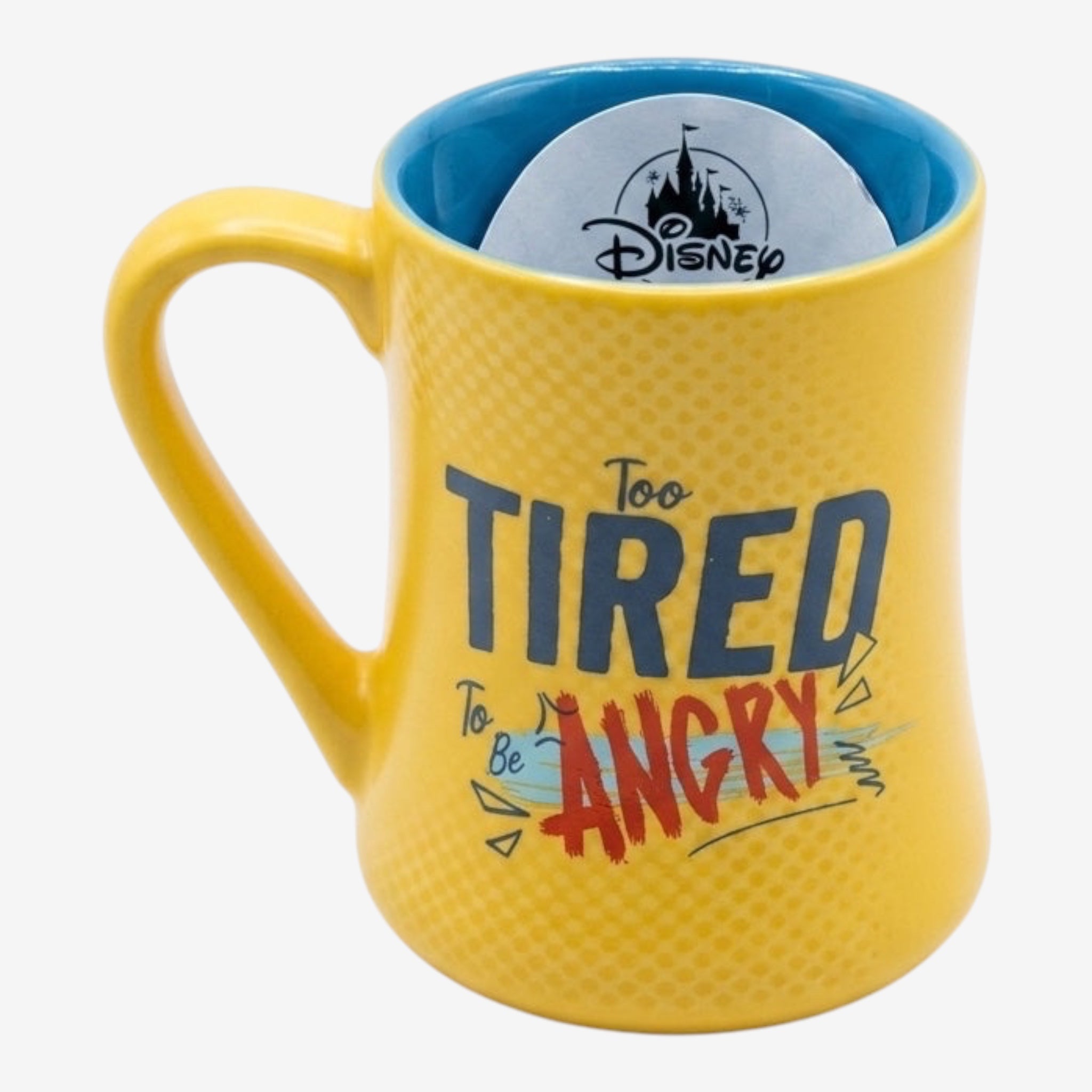 Once Upon Magic yellow ceramic mug with blue interior, featuring the text "Too Tired To Be Angry" and a Disney logo.