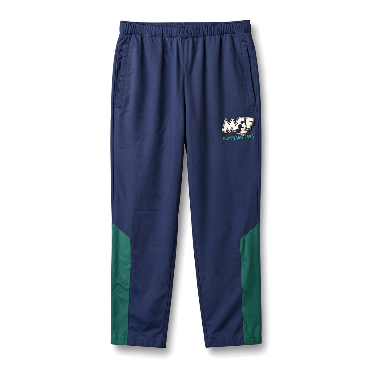 Pantalon Mickey & Friends bleu marine avec empiècements verts, taille élastiquée et logo Disneyland Paris – vue de face