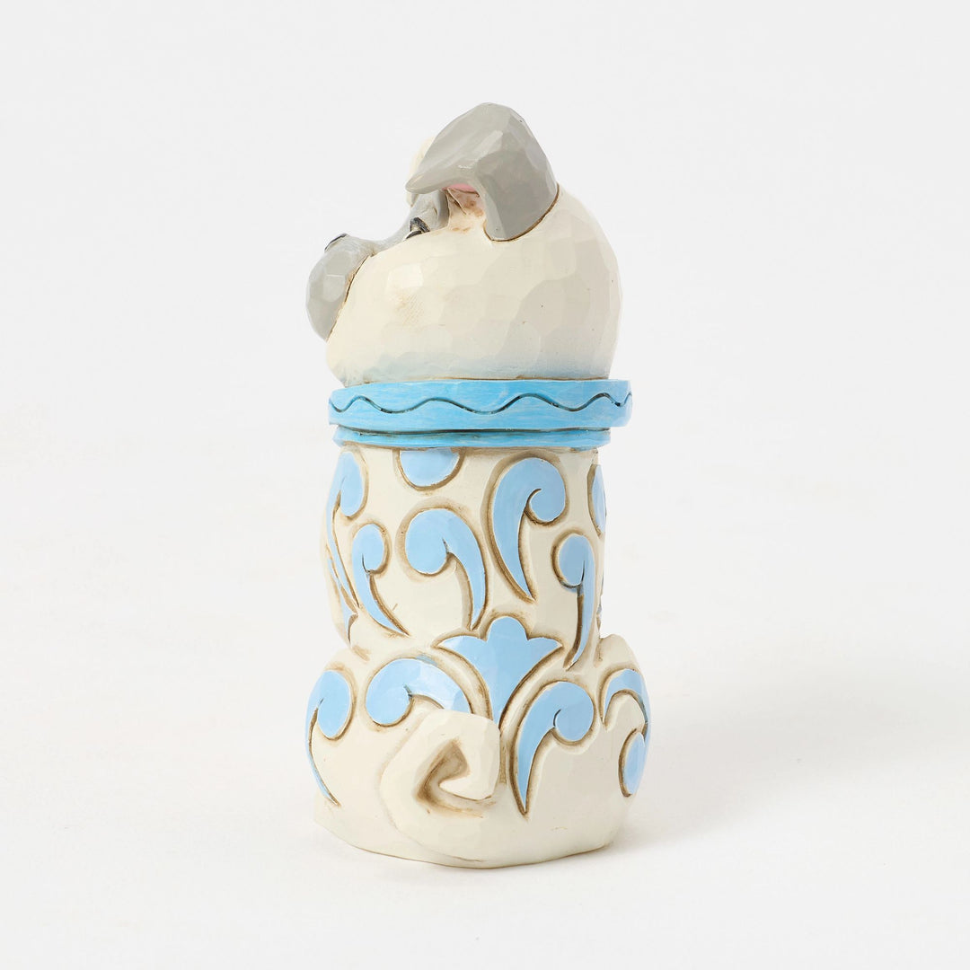 Figurine Percy Jim Shore vue de dos, avec collier bleu et motifs bleus et dorés