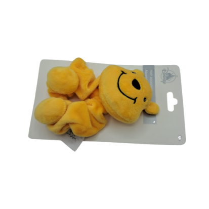 Chouchou peluche Winnie l’Ourson vu de côté – Disneyland Paris